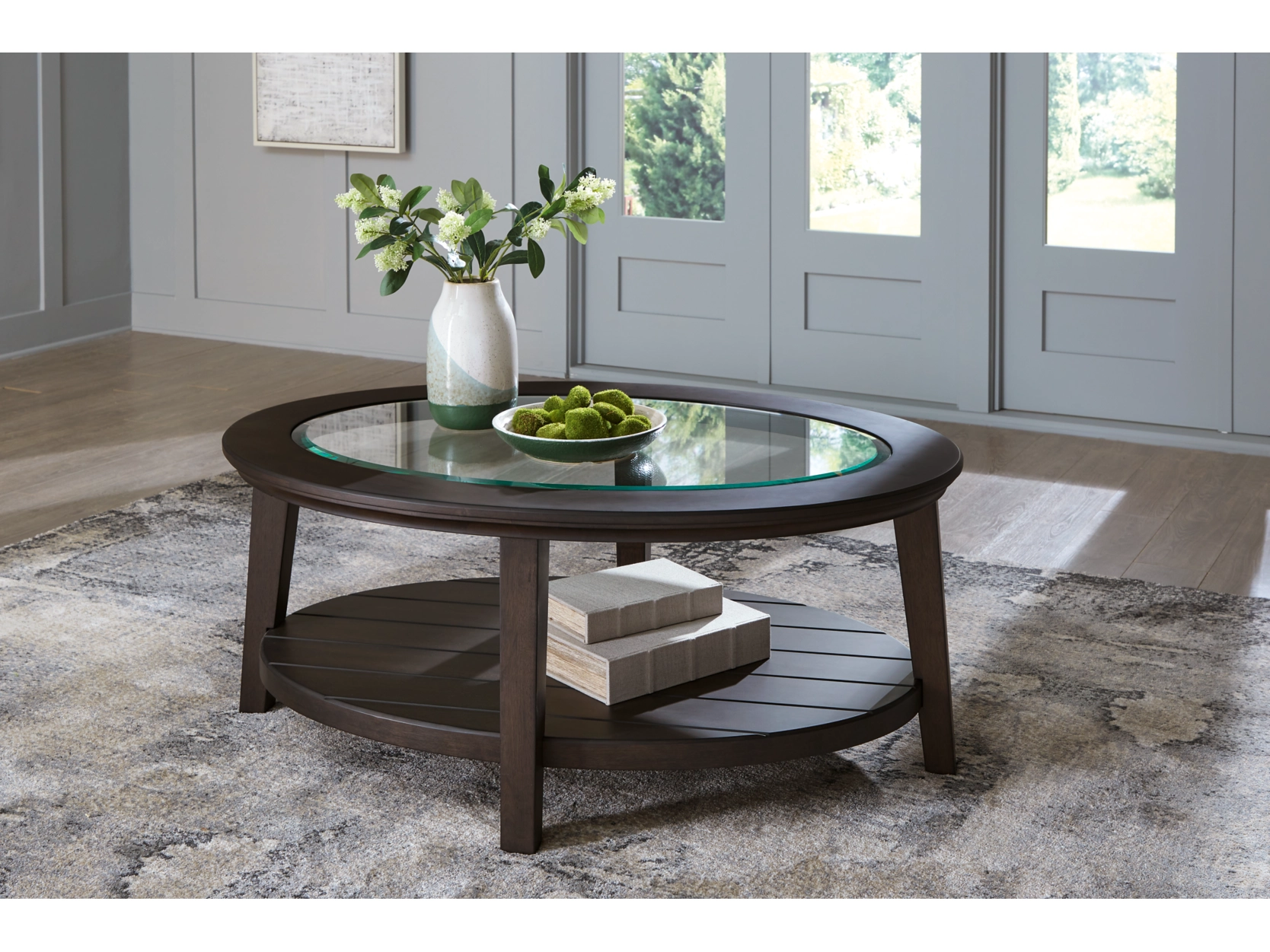 Celamar Oval Coffee Table in Dark Brown by Ashley
